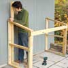 Mark Powers building the back crosspiece for his trash shed