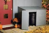 completed trash shed with door open showing 32-gallon recycling bin