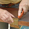 new mortices are cut to attach the new hardward where it will fit the shutter's new use as doors