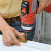 drilling screw holes to fit the hinges to the new mortises