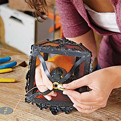 secure the housing and ground wire to rewire an all-weather lantern