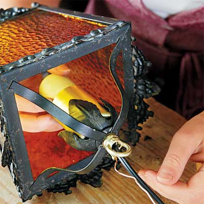 fit the socket in the housing to rewire an all-weather lantern