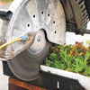cutting planted trays with a gas-powered concrete saw