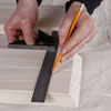 marking the side's location onto the top board with combination square and a pencil