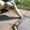 filling the joints in a stone walkway with fresh mortar