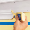 applying glue to a scarf joint to attach to three-piece crown molding
