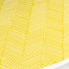 a finished table with a herringbone pattern combed onto it in yellow