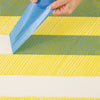 removing the tape from the first coat