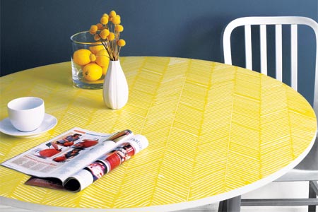 a finished table with a herringbone pattern combed onto it in yellow