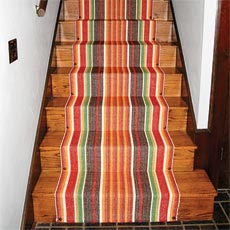 stairs with a colorful stair runner installed