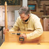 Tom Silva attaches the base to the table legs