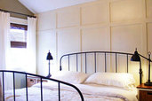 a bedroom with newly installed wood paneling
