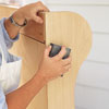 prepping the bench surface with a sanding sponge