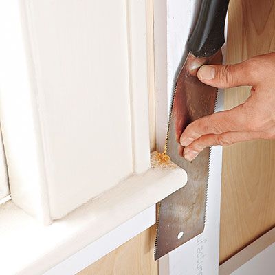 using a Japanese pull-saw to cut existing trim