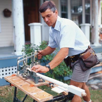 cutting the baluster to length using a miter saw