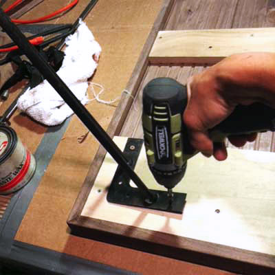 screw the legs into the battens to Build a Hairpin-Leg Coffee Table