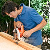 cutting the lamppost's wiring channel with a circular saw