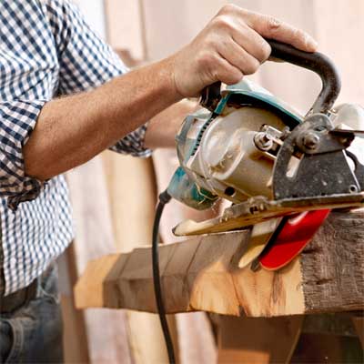 cut the beams to build a table from salvage beams