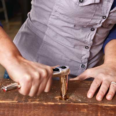 secure the straps to build a table from salvage beams