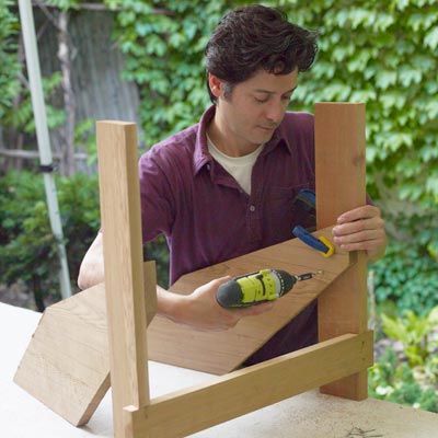 fastening the back legs of a Westport chair with a drill/driver