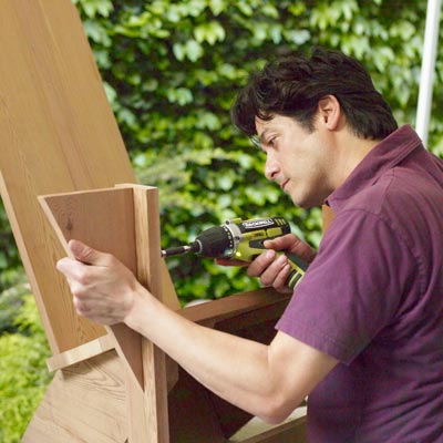 attaching the arm brackets to a Westport chair with a drill/driver
