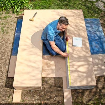 arranging and clamping together the pieces of the storage carcasses for a storage bed