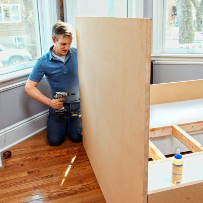 attaching the headboard of a storage bed