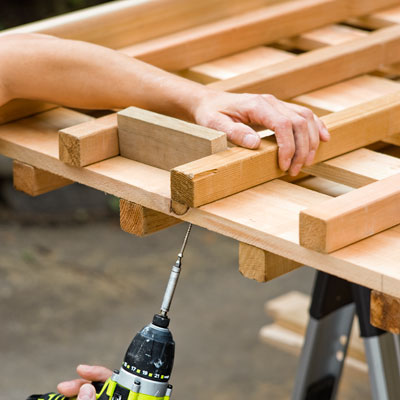 Mark Powers attaches the trellis pickets