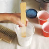 stirring the glaze with a stir stick
