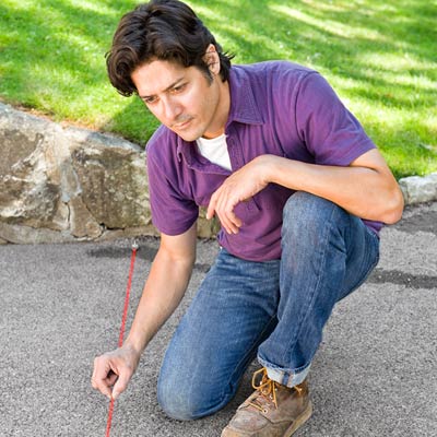 marking a driveway with a chalk line