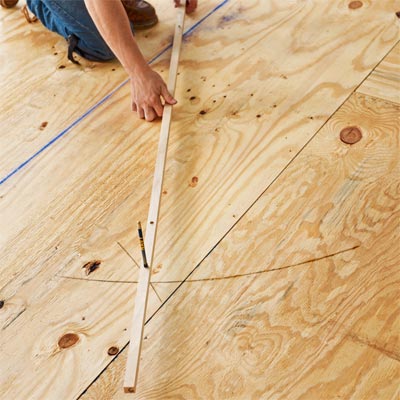 finding a center line with a trammel to install a herringbone floor