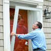 putting storm door in place to install a storm door