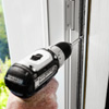 fastening the rails to install a storm door
