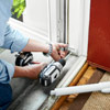 attaching the brackets to install a storm door
