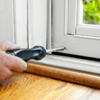 adjust the door sweep to install a storm door