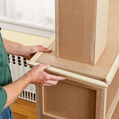 lining the columned room divider with crown molding
