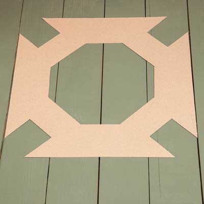 the geometric pattern template laid out on the floorboards