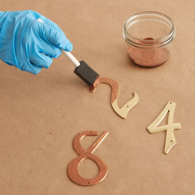 give metal look of copper patina apply copper surfacer to house number