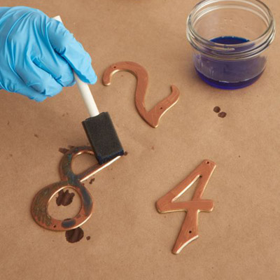 give metal look of copper patina apply solution to house number