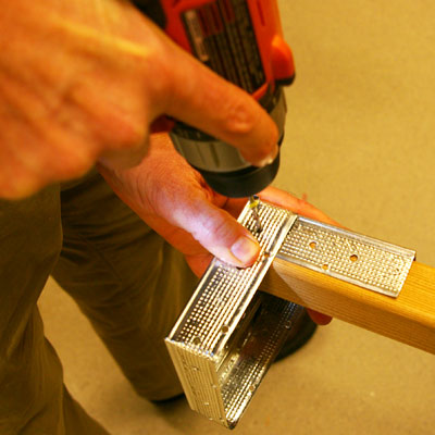 step by step how to make a candleholder of drywall corner bead, drill uprights and fasten onto base