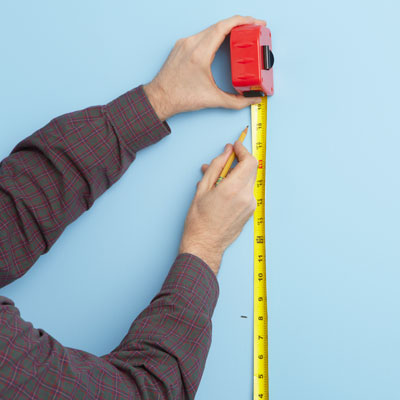 marking shelf areas with a tape measure