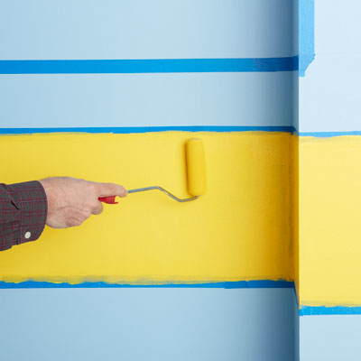 painting the yellow area with a dense foam roller