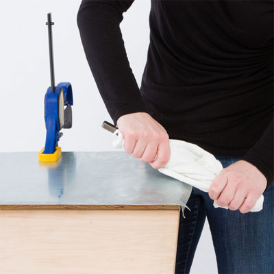 Bend the edges to make a zinc table top