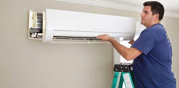 Mark Pauletti suing a remote to check airflow for How to Install a Mini-Split Heat Pump