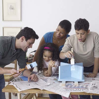 family painting the stool
