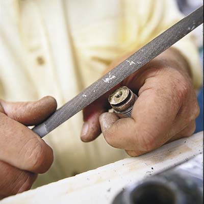 file away the pitted wall of the faucet washer