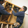 tom silva joining upper cabinets first with a clamp them securing with screws