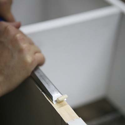 scooping out wood with chisel