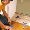 man positioning the water and electrical lines