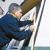 Fitting siding around windows.